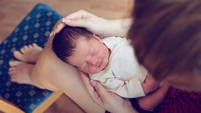 New mom holding newborn baby