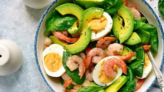 Salad with shrimp, avocado, and boiled egg