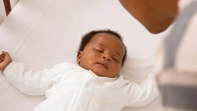 Baby sleeping in a crib 
