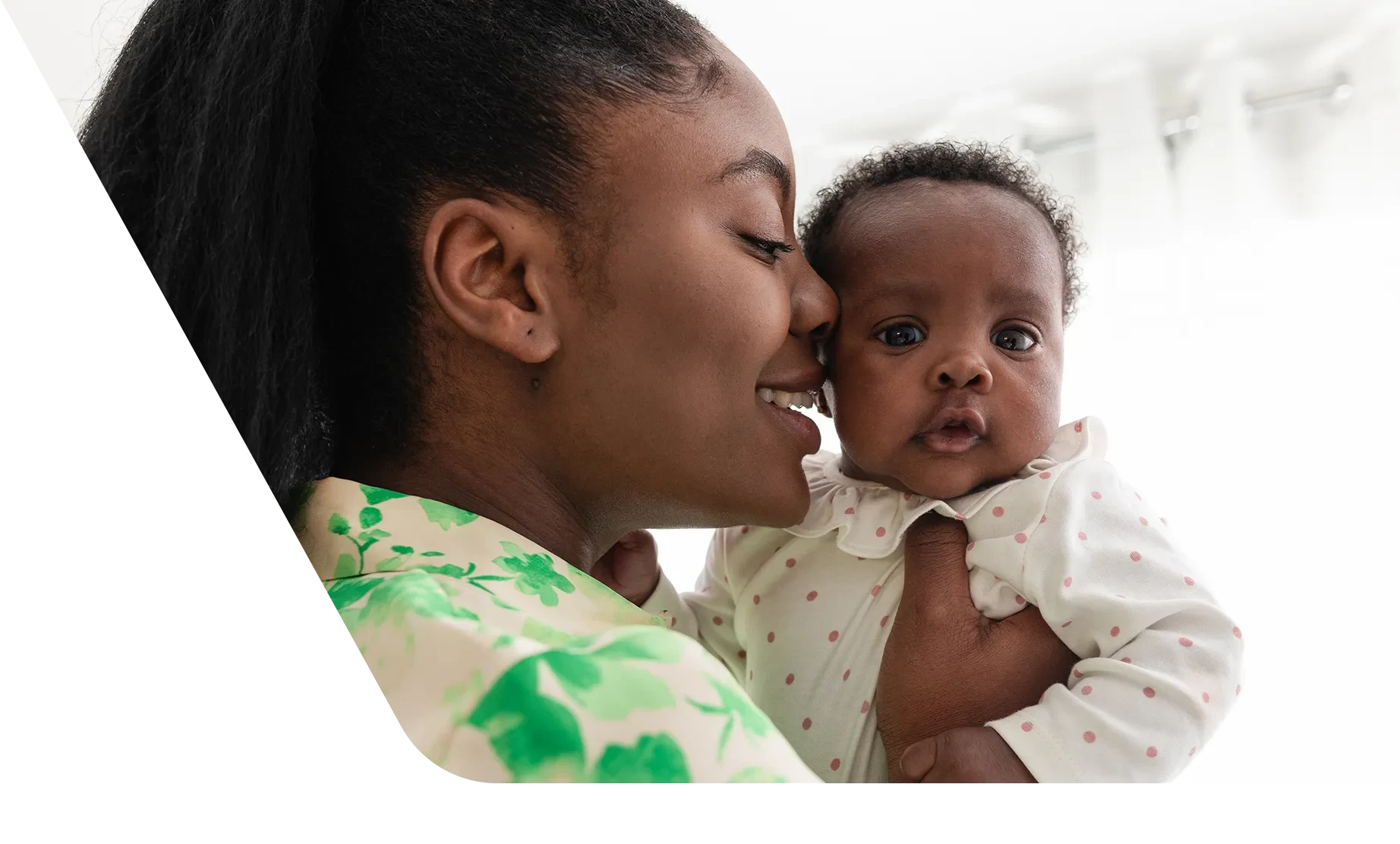 Mom holding baby, as baby has hiccups 