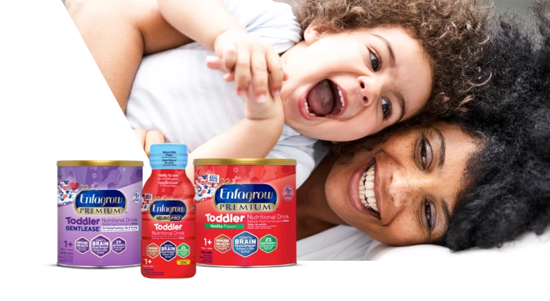 Laughing mom and toddler with a lineup of toddler nutritional drinks
