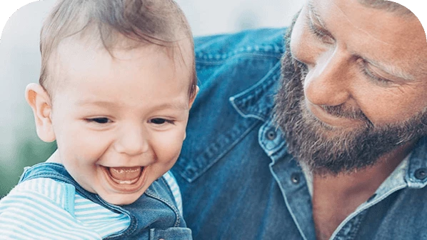 Dad smiling at young son