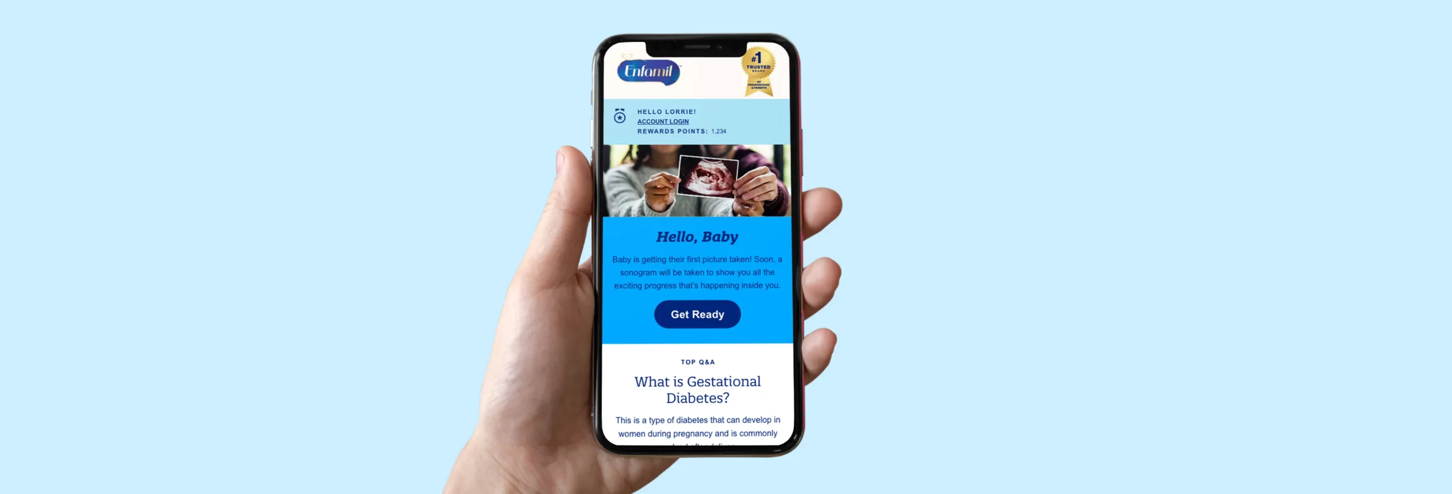 Person holding a phone that shows a baby milestone newsletter