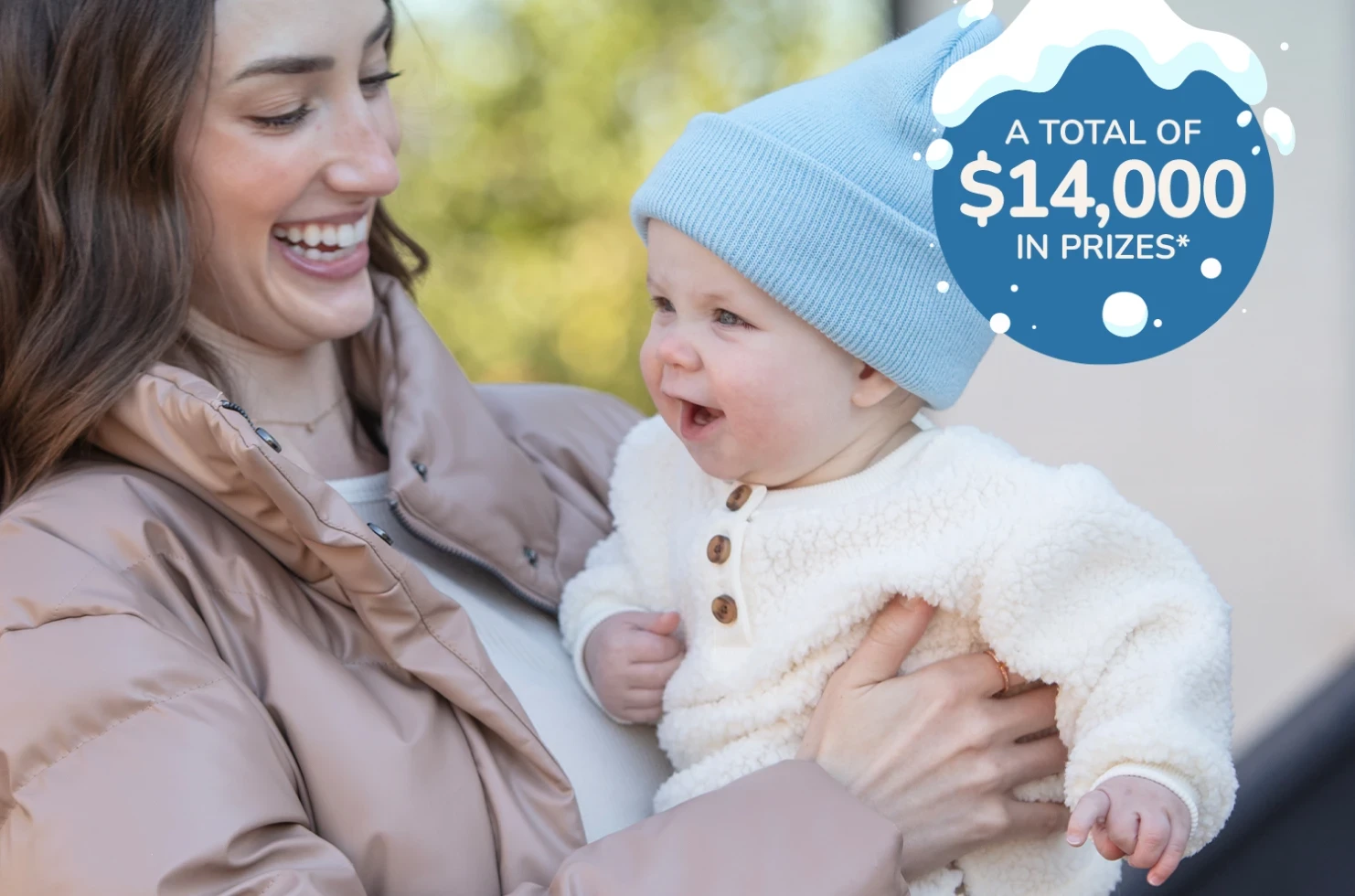 Mom and baby playing outside in winter and A total of $14,000 in prizes