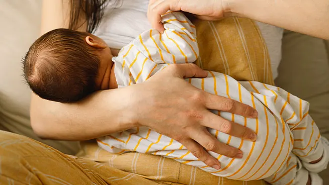 Mom breastfeeding newborn
