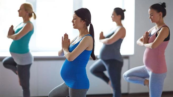 Group of expecting moms at prenatal yoga class