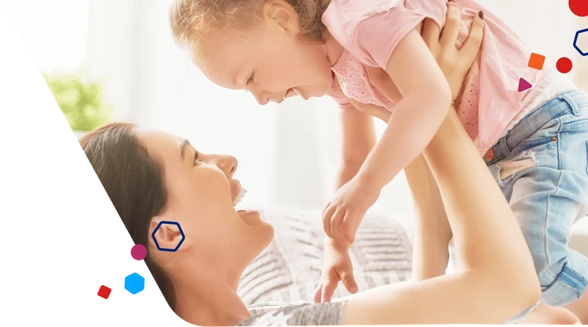 Mom lifting up happy toddler in the air