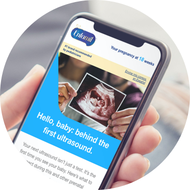 Closeup of someone holding a phone and reading an Enfamil article