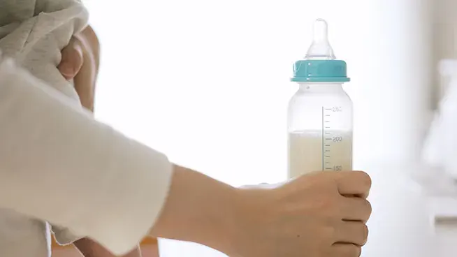 Mom holding a bottle