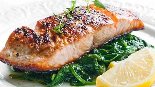 Grilled salmon on a bed of greens