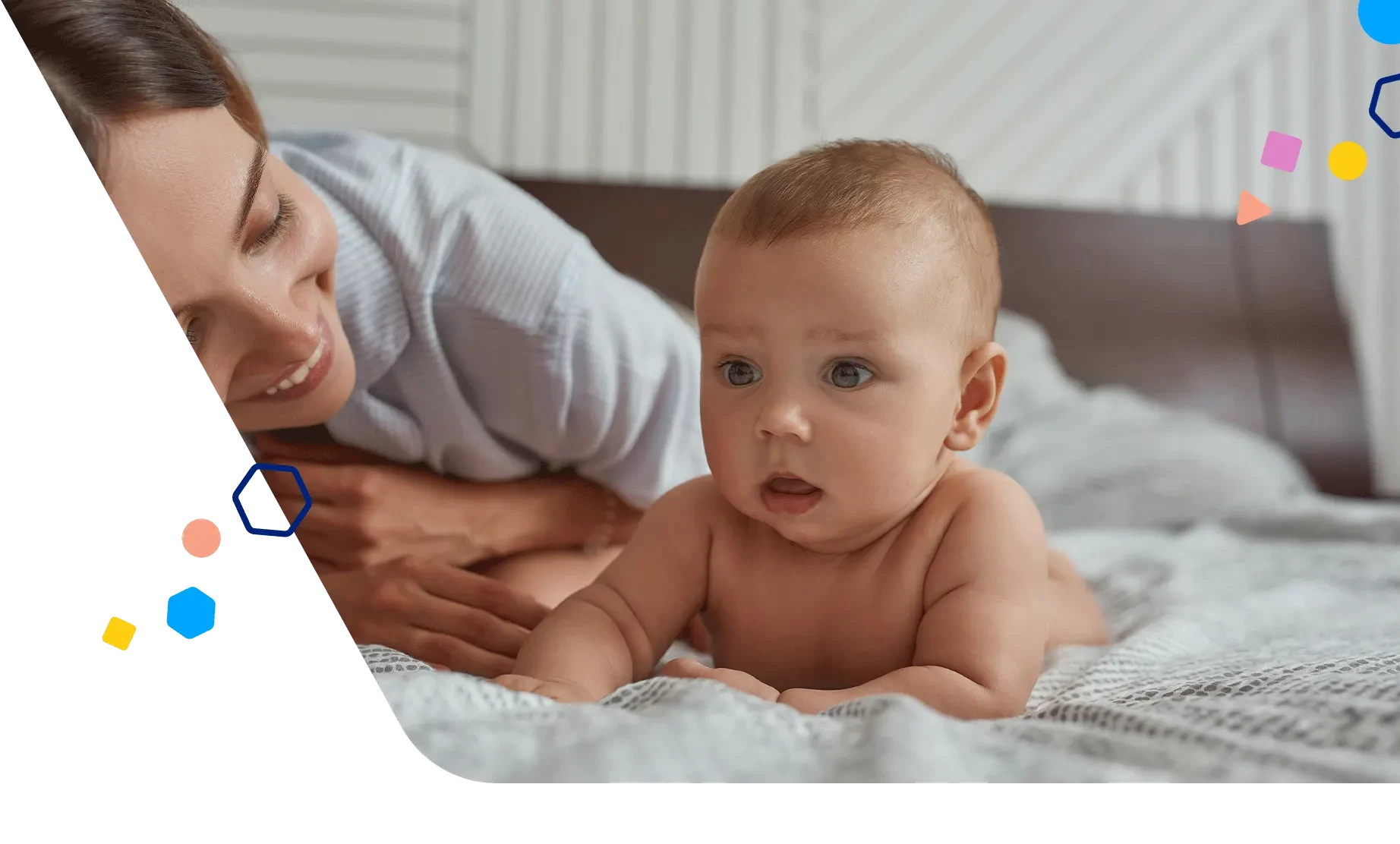 Baby getting tummy time while mom watches and encourages them