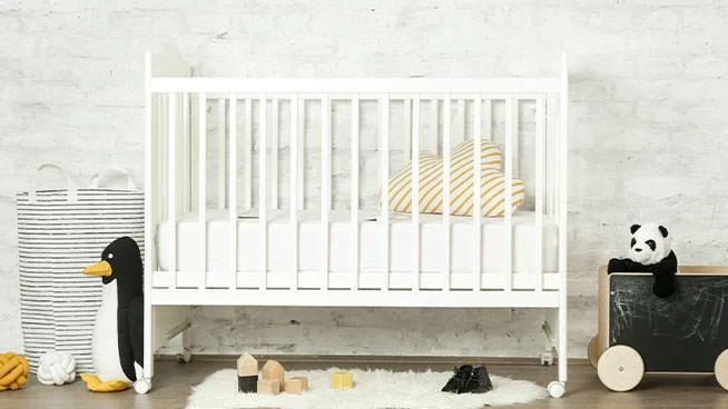 White crib in baby's nursery