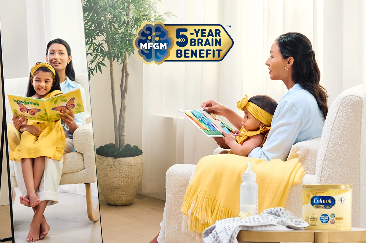 Baby being held by her mom sitting in a chair looking at a book, with Enfamil® NeuroPro™ Infant Formula that has MFGM 5 year benefit