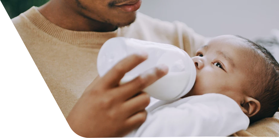 Dad feeding baby a bottle