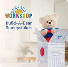 Build-A-Bear box with teddy bear popping out the top