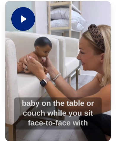 baby on the table or couch while you sit face-to-face with